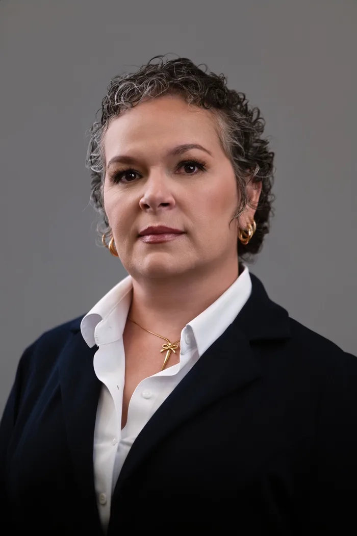 Retrato de Yudelmis García Rifa, gerente de oficina de A&M Contigo